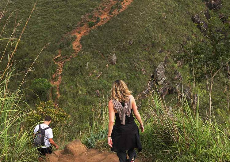 A Couple hiking along the Pekoe Trail one of the top adventurous things to do in Sri Lanka